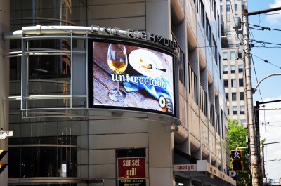 Outdoor digital signs displaying full-motion content are approved only by special variance or bylaw amendment.