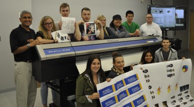 Pictured are Ryerson associate professor Abhay Sharma (far left), his students and Matt Anderson, service account manager for Roland DGA (back row, far right).
