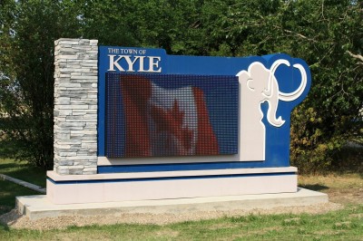 The entranceway signage for Kyle, Sask., incorporates an electronic message centre (EMC) within a foam enclosure and the town’s woolly mammoth mascot.