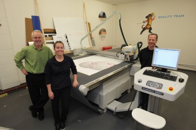 Pictured left to right are: Carl May, president of True Colours; Lorna May, machine operator; and Bryan Hall, display graphics sales specialist for Fujifilm Canada.