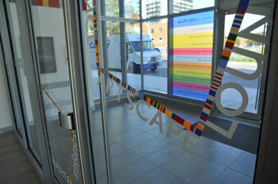 The Artscape Lounge is identified with cut vinyl applied to its doors.