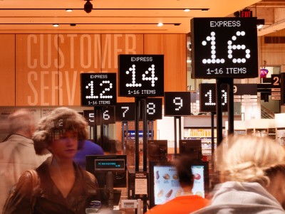 A hockey scoreboard font is used to indicate cash counter numbers.