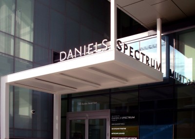 The building’s name is repeated over the east entrance vestibule with clear-coated, pin-mounted stainless steel letters.