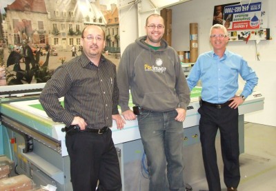 Pictured left to right are: Michel Theriault, sales specialist for Fujifilm Canada; Jonathan L’Heureux, operator at Posimage; and Martin Boisvert, founder and president of Posimage.)]