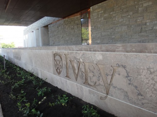 The school’s name was sandblasted directly into the main entrance’s limestone wall (left) and a retaining wall near the south entrance (right).