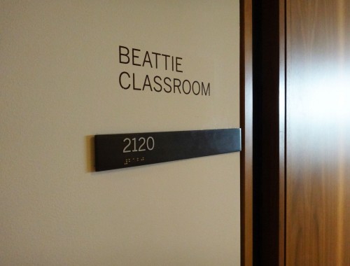 Cut-out bronze pictograms were used for washroom signs.