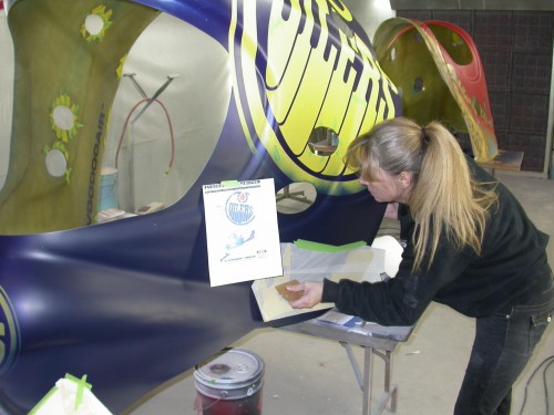 Silhouettes of oil rigs are added as layered graphics.