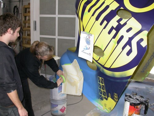 More paint masks are applied, using a squeegee, to add further graphics. The original Oilers colour is also reapplied.