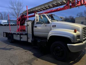GMC 6500 Gas truck with 65' Skyhook Crane photo.