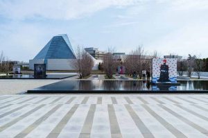 ‘Reflection of Hope’ is a series of large-format photographic works by Aida Muluneh, which Four By Eight installed in reflective pools throughout an outdoor park at the Aga Khan Museum. Photo courtesy Aly Manji