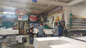 Moving the large, heavy letters from one phase of manufacturing to another required lots of planning and teamwork.