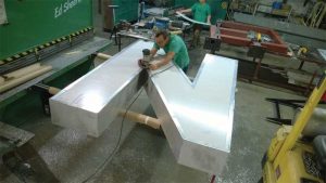 The individual letters were sanded down and made even.
