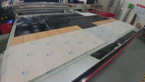 Since the client had supplied the material, the team had to verify the dimensions on paper with the physical pieces. Pre-testing was done to ensure the prints aligned properly.