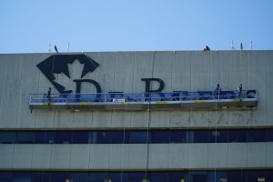 Multiple trips were made going up and down the high-rise building during the sign removal phase, ensuring the stage was not overloaded at any given time. Once the bottom letters were removed, the sign installers moved on to the larger ones.
