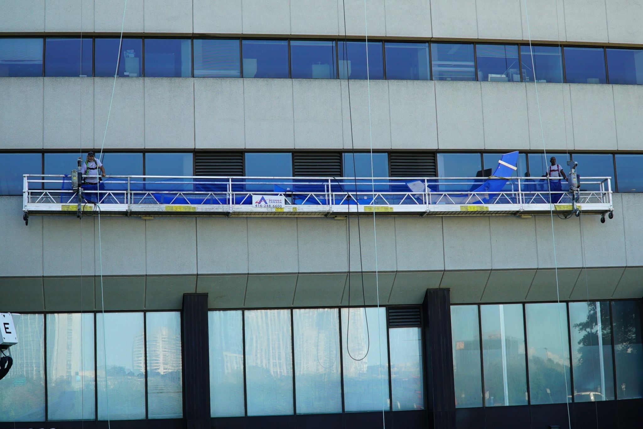 Once the letters arrived from the factory, they were ready to be hauled up on the swing stage.