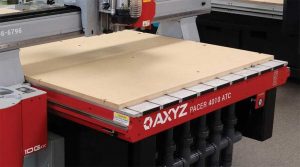 Photo courtesy AXYZ The medium-density fibreboard (MDF) spoil board, or sacrificial bed, is mechanically fixed to the T-slot bed and acts as a sacrificial diffuser. It can be skimmed to provide a stable and flat working surface and is replaceable.