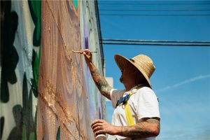 Photo courtesy City of Nanaimo Russell Morland painted a wraparound retaining wall in the parking lot at 95 Cavan St. He draws inspiration from the worlds of lowbrow, street art, skateboarding, and board games.