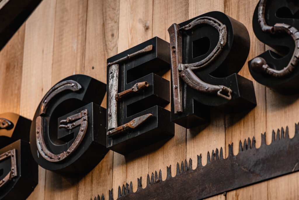 An old hatchet was used to make the ‘L,’ and an old hammer handle was used to create the ‘E.’