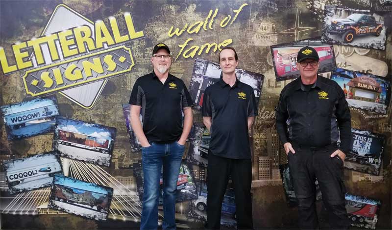 Photo courtesy Letterall Signs Inc. Left to right: Cory Byrnes, Rob Merkel, and Rollin Penner of Letterall Signs Inc.