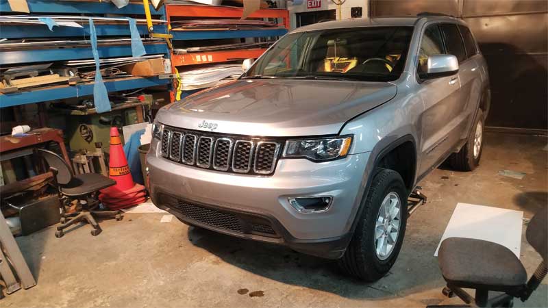 The client wanted to spice up his new Jeep. He wanted the front bumper to be wrapped matte black and flames added to the hood.