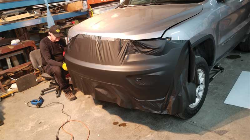 The first step was wrapping the bumper. The team used 3M 2080 film for a better fit around the curves and to achieve a sleek appearance.