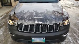 The badging was replaced after the wrap had been installed. The end result mimicked a painted finish.