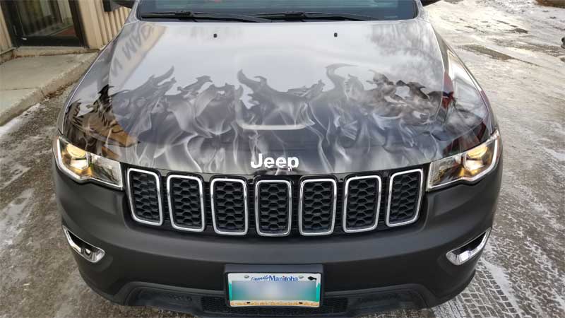 The badging was replaced after the wrap had been installed. The end result mimicked a painted finish.