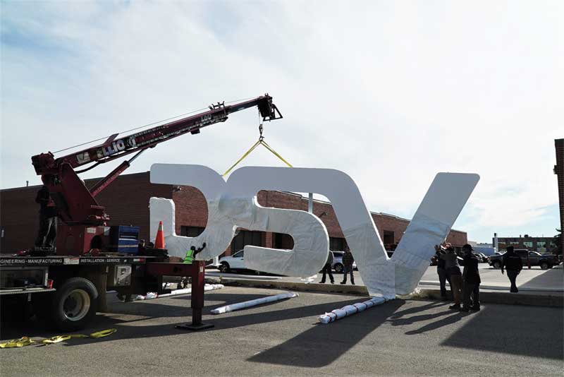 Moving such a large and heavy sign with such ease was, at the same time, both stressful and impressive. Moving such a large and heavy sign with such ease was, at the same time, both stressful and impressive.