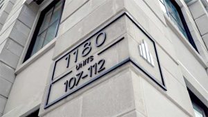 Signage with simple logos and geometrical shapes can help gravitate people towards your brand.