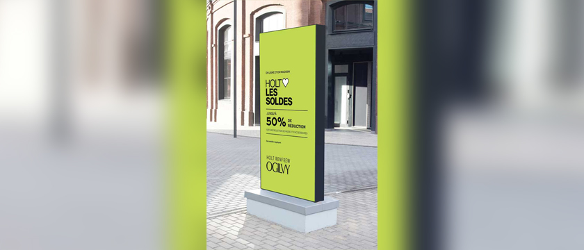 A digital outdoor display advertising the Holts campaign.