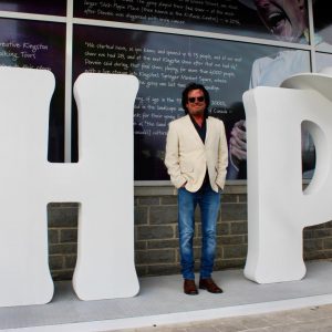 Paul Langlois, member of the band, poses as part of the immersive display.