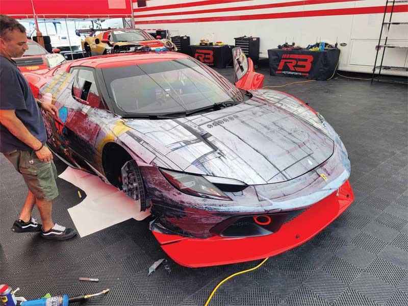 The Ferrari being wrapped in the studio.