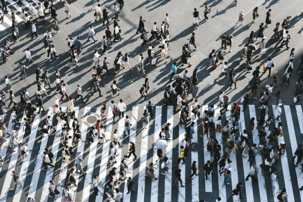 People crossing a busy intersection
