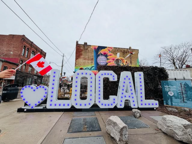 The large LED signs which display a heart along with the letters LOCAL in all caps.
