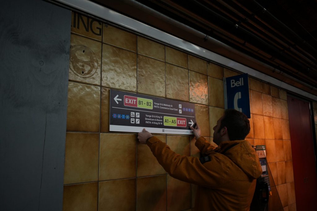 People installing the signs.