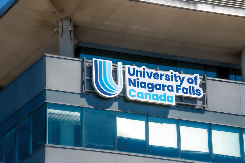 One of the exterior signs reading "University of Niagara Falls Canada"