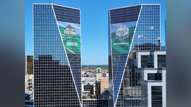 The Grey Cup signs on the towers.