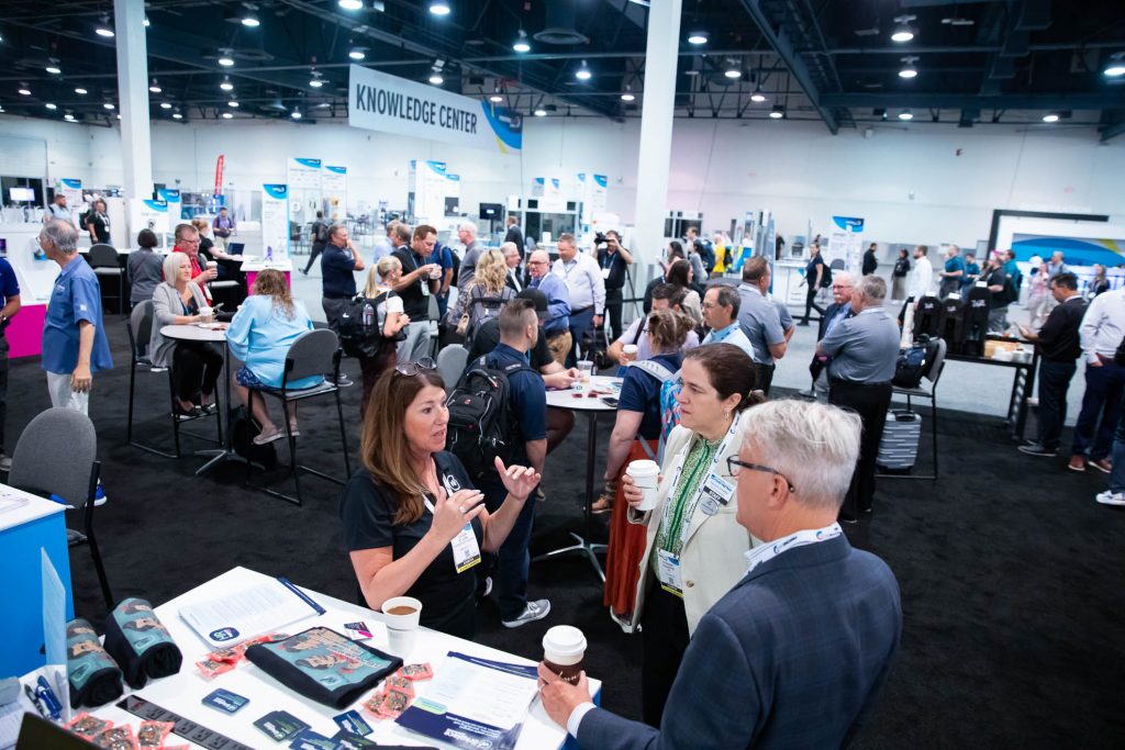 People walk the floor at PRINTING United Expo 2024.