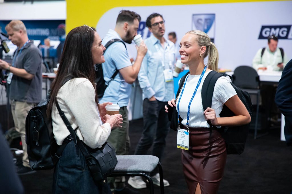 People chat at the Expo.