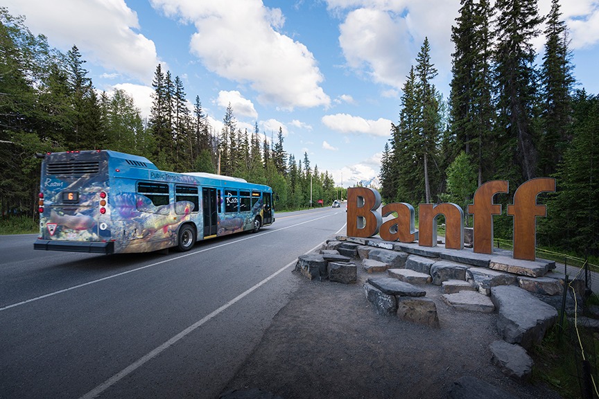 Photo of the bus driving past the sign at its current location.