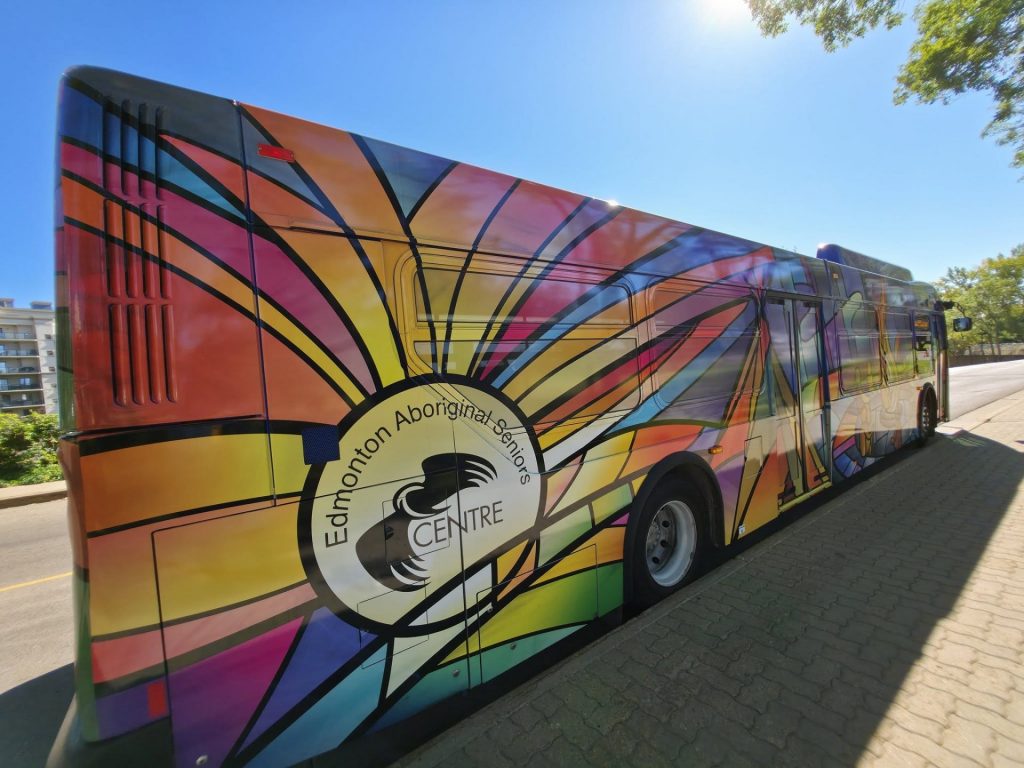 The bus wrap zoomed in with the EASC logo seen.