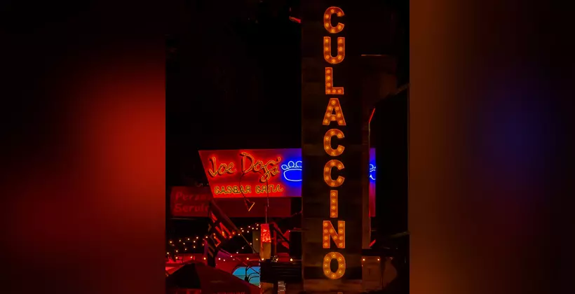 The sign at night.
