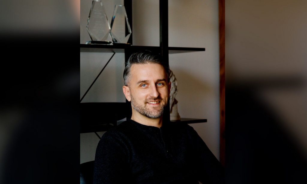 A headshot of Adam Krahn.