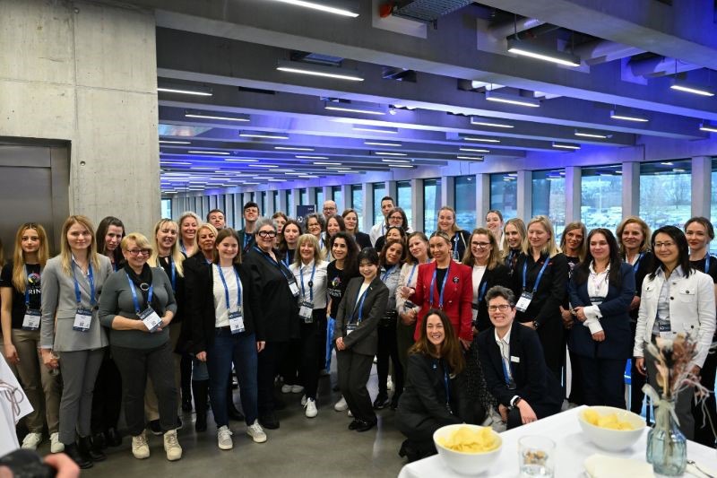 Women pose for a photo during an event.