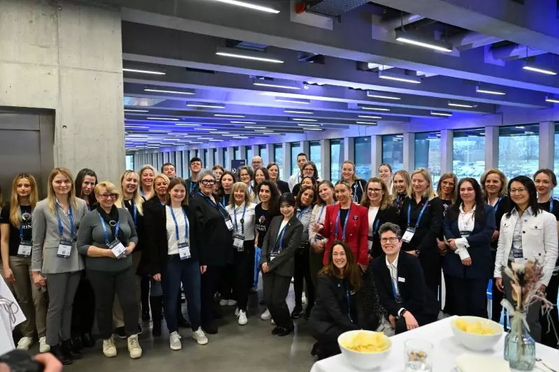 Women pose for a photo during an event.