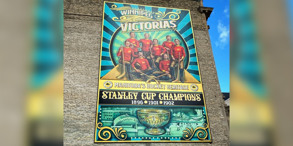 A full view of the mural on the wall.