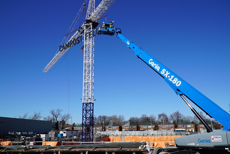 An installation in process with a crane lift.
