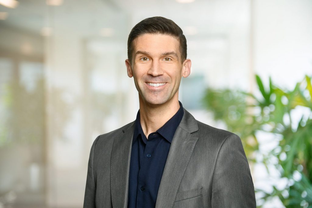 A headshot of Justin Boudreau. 