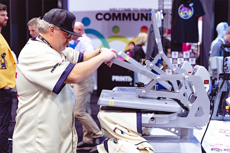 A person printing on fabric.