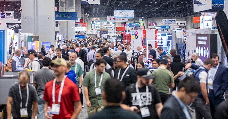 People walk the trade show floor at the PRINTING United Expo.